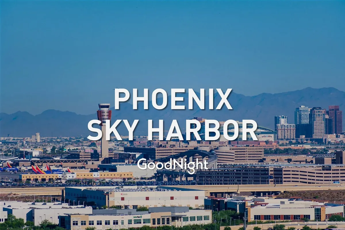 A dynamic scene featuring Phoenix Sky Harbor Airport with the downtown Phoenix skyline and surrounding mountains in the background. The image evokes convenience and accessibility for business travelers, highlighting the property’s urban location and ease of access to major travel hubs.